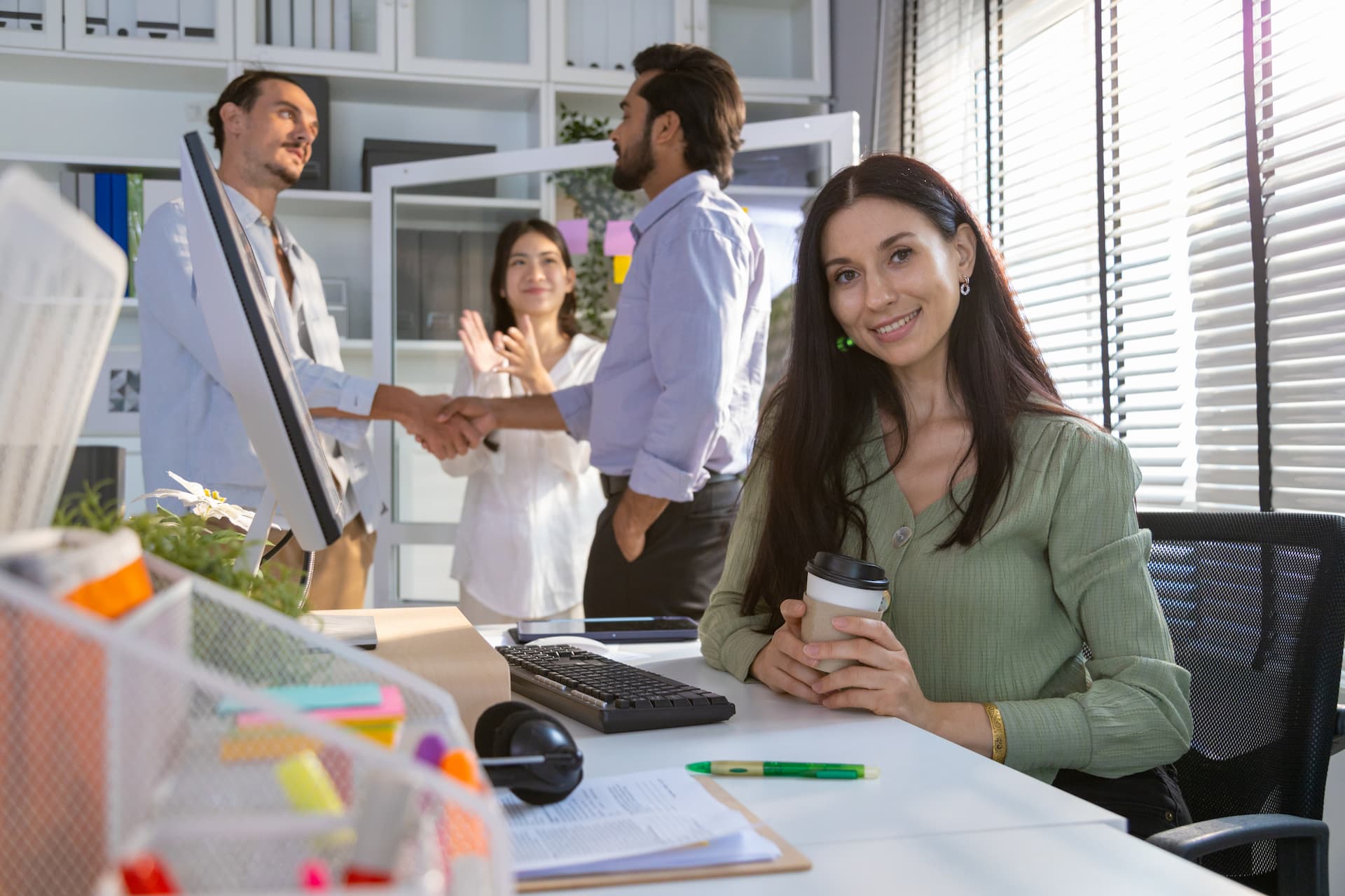 Colleagues collaborating together in a modern workspace